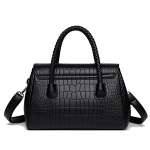 Classic black faux crocodile leather handbag with woven handles and crossbody strap