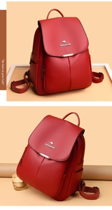 Detail view of red textured leather backpack with flap closure and kangaroo logo branding