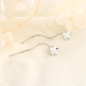 Elegant silver four-leaf clover threader earrings with shimmering zircon stones