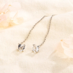 Detail of S925 sterling silver long tassel ear threads with heart-shaped zircon stones