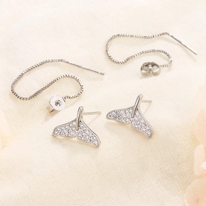 Detail of S925 silver fishtail earrings with sparkling pavé cubic zirconia settings