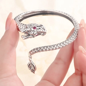 Vintage silver dragon open bangle with red gemstone eyes and scale textures