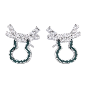 Detail of reindeer stud earrings with green enamel and sparkling zircon antlers