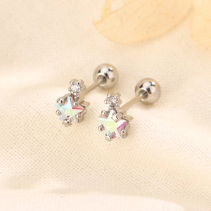 Macro shot of colorful star stud earrings with iridescent opal and secure screw-back design