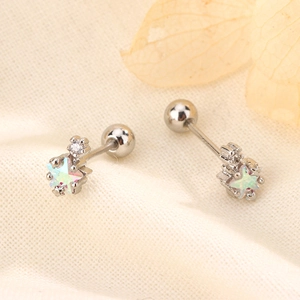 Close-up of star-shaped stud earring with colorful zircon and secure screw-back ball