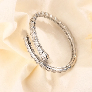 Luxurious snake-shaped open bracelet with sparkling pavé zircons in a flexible scale design