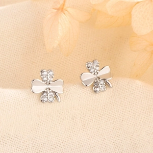 Detail of s925 silver four-leaf clover earrings with sparkling cubic zirconia stones