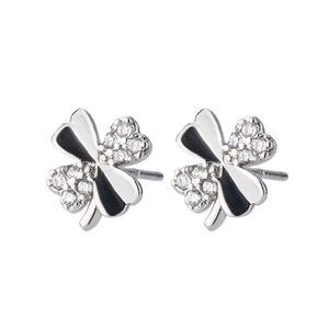 Close-up of S925 silver clover studs with black enamel and micro-set cubic zirconia