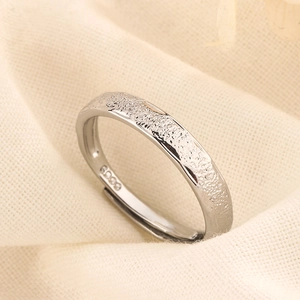 Macro shot of S925 sterling silver ring with frosted starry texture and hallmark detail