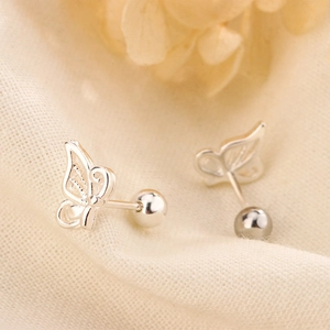 Detailed close-up of hollow butterfly screw back earrings with silver polished finish