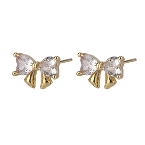 Detailed view of S925 silver bow earrings with gold plating and heart-shaped zircons