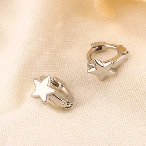 Polished S925 sterling silver star hoop earrings on a soft beige knit fabric background