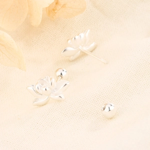 Macro shot of 925 silver lotus earrings with spiral back and spherical screw-on stoppers