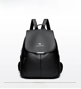 Close-up of black lychee grain leather backpack with flap cover and kangaroo logo