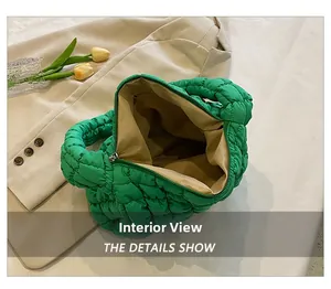 Internal view of green quilted cloud tote bag showing spacious lining and zipper pocket