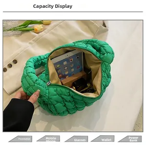 Interior view showing the large capacity of a bright green quilted cloud tote bag