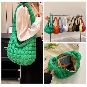 Detailed view of spacious quilted puff cloud bag showing 9 vibrant colors and large interior