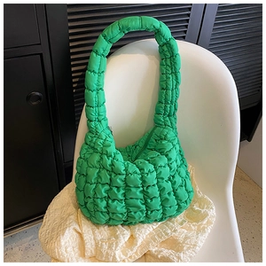 Detail of lime green quilted bubble texture tote bag with thick integrated handle