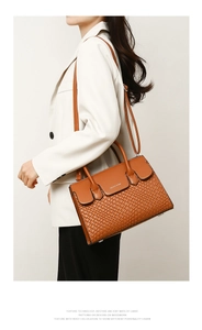 Detail of caramel tote bag showing the woven texture and BALAUI & BAG logo on leather