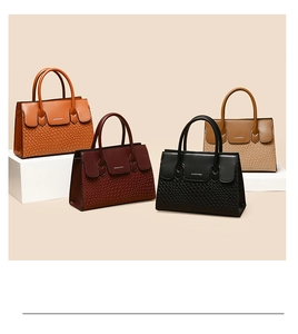 Detailed view of woven texture tote bags in brown, wine red, black and khaki colors