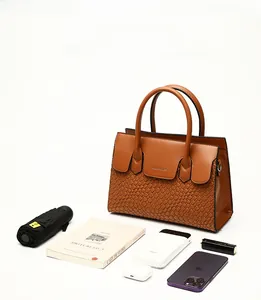 Caramel woven leather tote bag showcasing large capacity for phone, lipstick and books