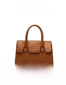 Close-up of light brown woven texture and branded logo on a minimalist tote bag