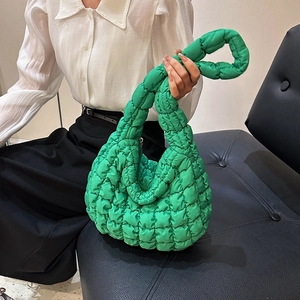 Quilted bright green cloud tote bag with puffy padded texture and stylish shoulder strap