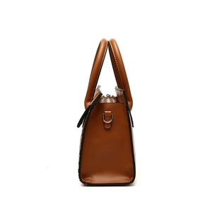 Brown woven texture leather tote bag for women showing side profile and top handles