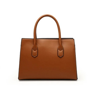 Brown leather woven tote bag for women featuring a minimalist trapezoid handle design