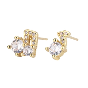 Macro view of musical note stud earrings with sparkling cubic zirconia in gold plating