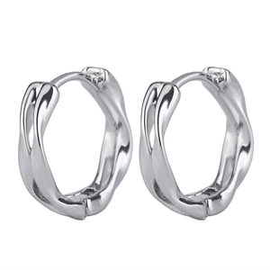 Detailed close-up of Mobius silver hoop earrings with irregular wavy twisted design