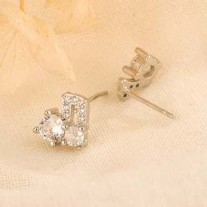 S925 silver music note stud earrings featuring sparkling cubic zirconia for women