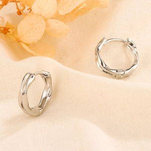 Elegant S925 sterling silver Mobius twist hoop earrings with a polished wavy metallic finish