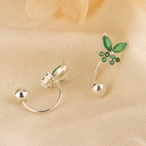 Close-up of S925 sterling silver butterfly earrings with green zircon and silver beads