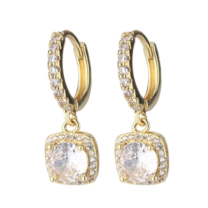 Detail of gold hoop earrings with square cubic zirconia pendants and pavé diamonds