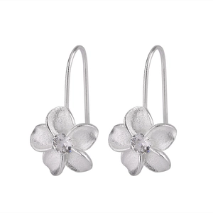 Detailed macro of S925 silver flower stud earrings with brilliant zircon center stone