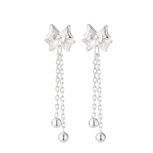 Silver hollow bow tassel earrings with filigree texture and delicate hanging silver beads