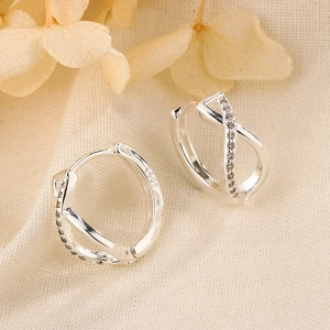 Elegant S925 sterling silver crossover hoop earrings with shimmering white zircon stones