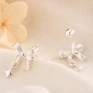 Minimalist silver bow earrings with star pendants and screw back ball closures