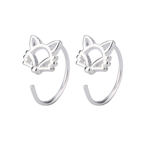 Detailed view of hollow fox tassel earrings in silver finish with delicate metal craftsmanship