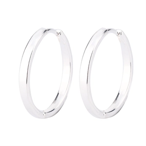 Close-up of minimalist silver hoop earrings with polished finish and secure clasp