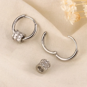 Detail view of S925 sterling silver hoop earrings with a sparkling zircon bead charm
