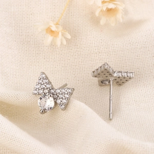 Exquisite 925 silver bow stud earrings with sparkling cubic zirconia pavé detailing