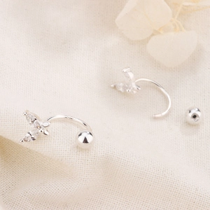 Macro shot of S925 sterling silver butterfly stud earrings with sparkling cubic zirconia