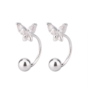 Macro shot of S925 silver butterfly earring with marquise-cut zircon stones and steel stamp