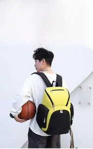 Close-up of a high-capacity yellow and black sports backpack with multi-pocket design