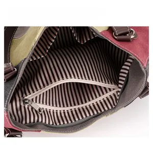 Interior view of the canvas tote bag showing zipper pocket and dual inner slip pockets