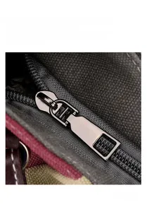 Detail of durable dark gray canvas texture with high-quality metal hardware zipper puller