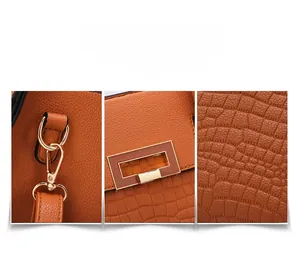 Close-up of orange embossed crocodile pattern leather and premium gold metal hardware