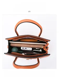 Orange leather tote bag interior view showing large capacity for iPad and umbrella
